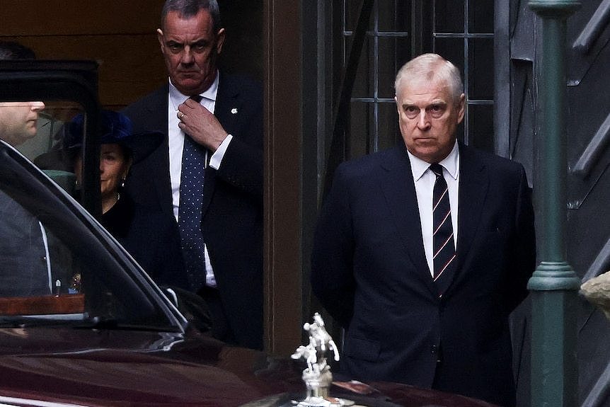 Prince Andrew stands outside Westminster Abbey at the thanksgiving service for Prince Philip.