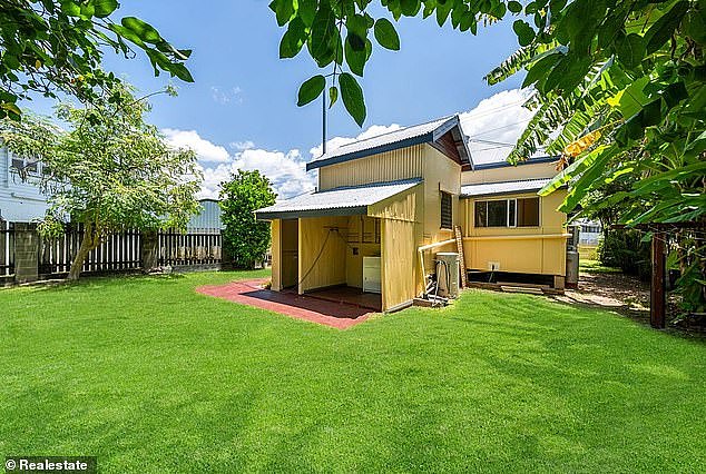 House prices across affordable regional Queensland cities are expected to keep surging by double-digit figures in 2025 as they fall in Australia's biggest cities (pictured is a house in South Townsville on the market in the low $500,000s)