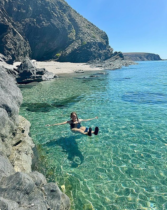 Rapid Bay Beach in South Australia beams with glistening turquoise waters against the white sand and towering cliffs, making it a perfect spot to unwind or soak up the sun