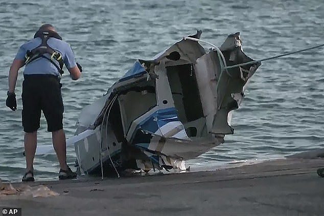 Earlier today, the wreckage of the Swan River Seaplane-run plane was pulled from the water (pictured)