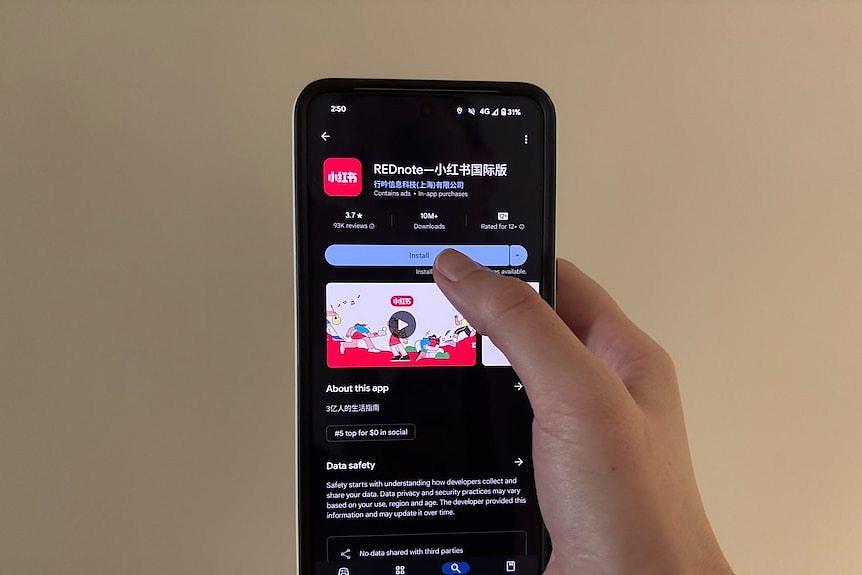  A phone screen shows the Google Play listing for REDnote
