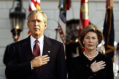 US President George W Bush and first lady Laura Bush observe a moment of silence.