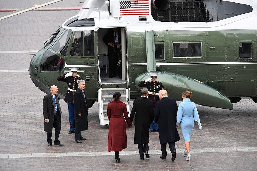  Barack Obama and Michelle Obama walk to Marine One with President Donald Trump and Melania Trump 