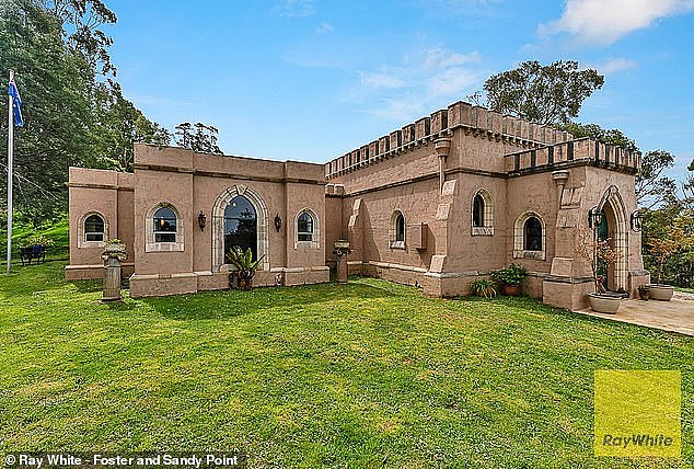 The castle reveals itself at the end of a meandering driveway lined with Italian Pencil Pines and lush tree fern