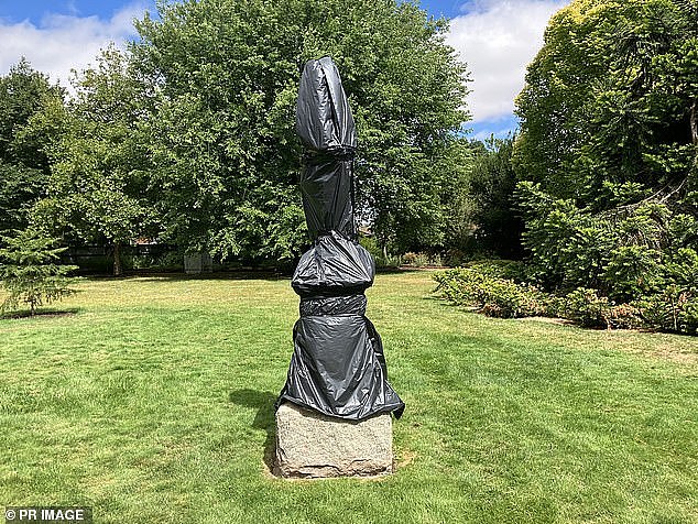 Vandals also covered the name plates of the 18 remaining in spray paint as police hunt for the those responsible for the act (pictured one of the sculptures vandalised)