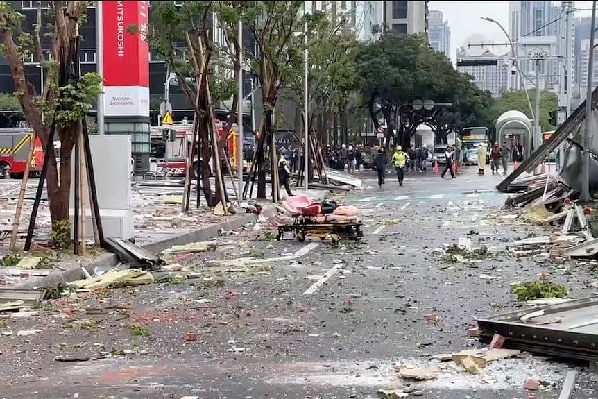 debris are strewn across the streets in the aftermath of the explosion.