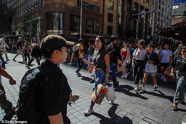 Westpac, Australia's second biggest lender, has cuts its variable rates by 40 basis points to 6.44 per cent (pictured are Sydney pedestrians)