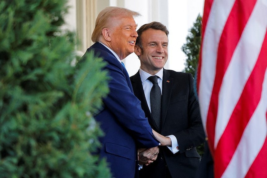 Trump shakes hands with French President Emmanuel Macron at the White House