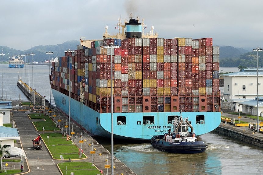 A container ship on a canal