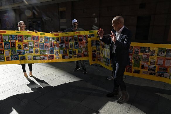 Charlie Teo is greeted by supporters as he leaves the last day of his inquiry.