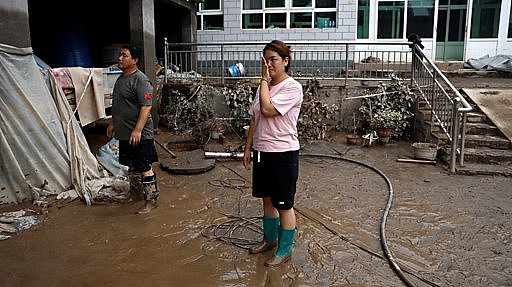 中国水灾：两个家庭诉说家破人亡的悲惨经历（组图） - 3