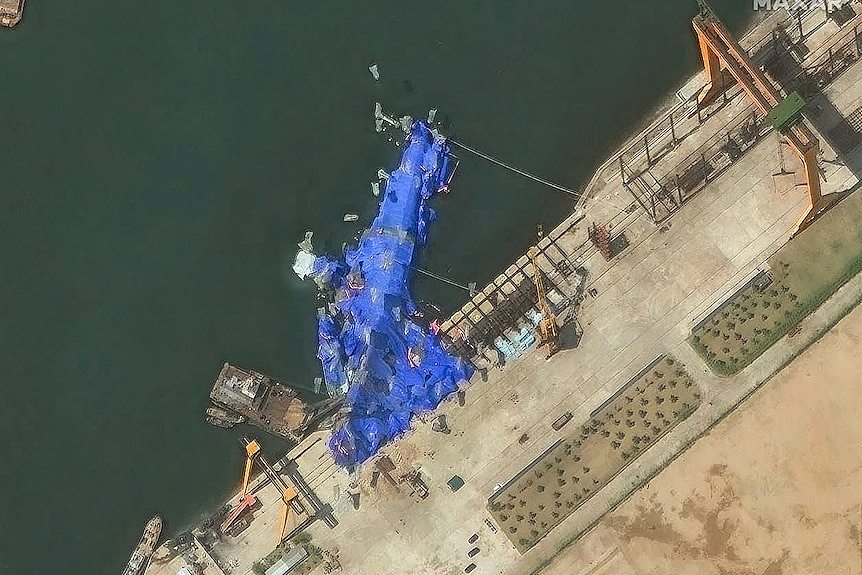 朝鲜为何公开报道驱逐舰下水事故?(组图) - 1