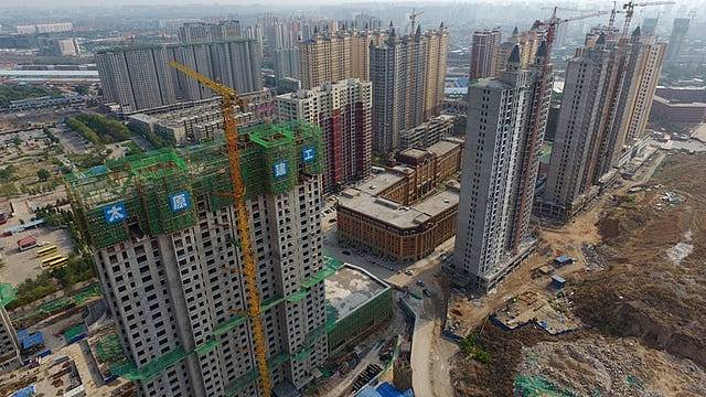 中国建筑业产值达32.7万亿,中国建造海外订单超万亿美金(组图) - 1