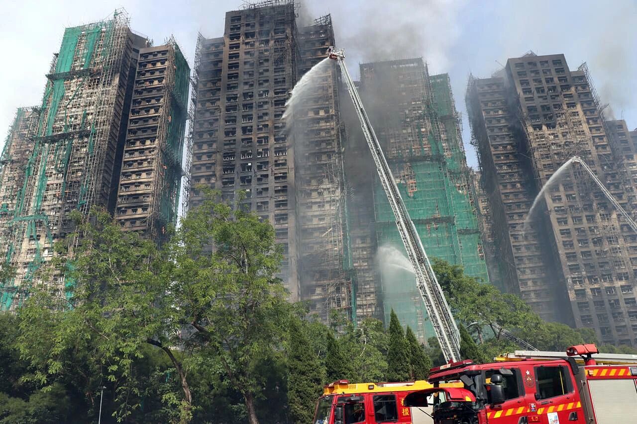 香港大火之下,风暴眼中的竹棚工(组图) - 1